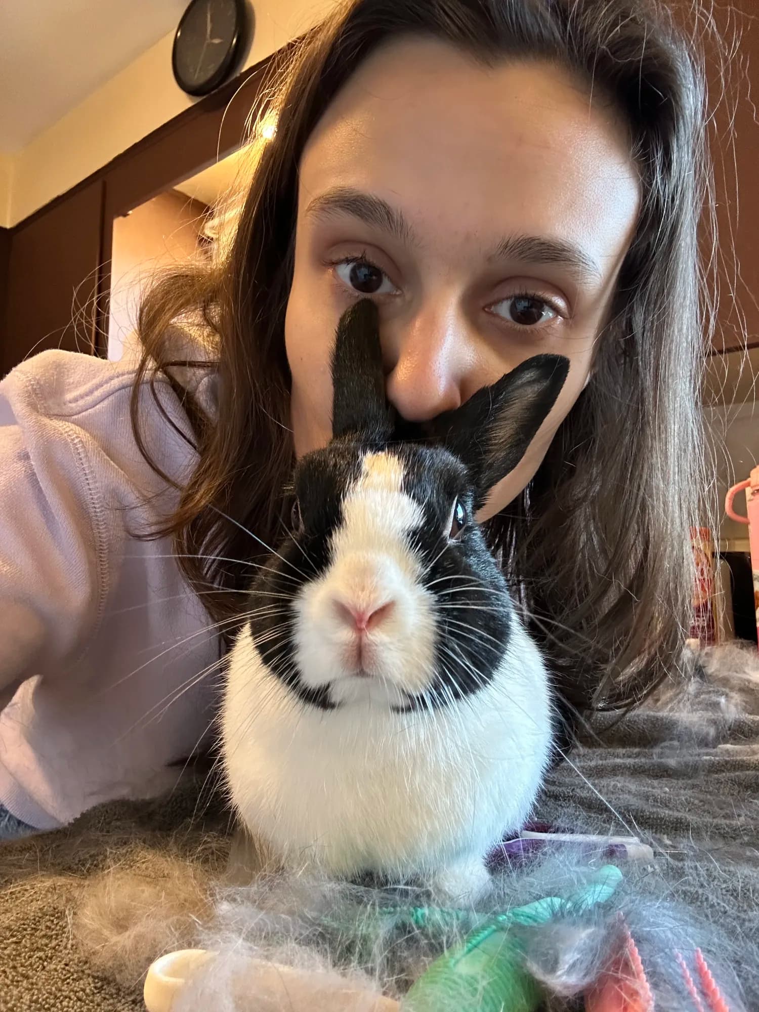 The Little Rascals owner taking a close-up selfie with a black and white rabbit